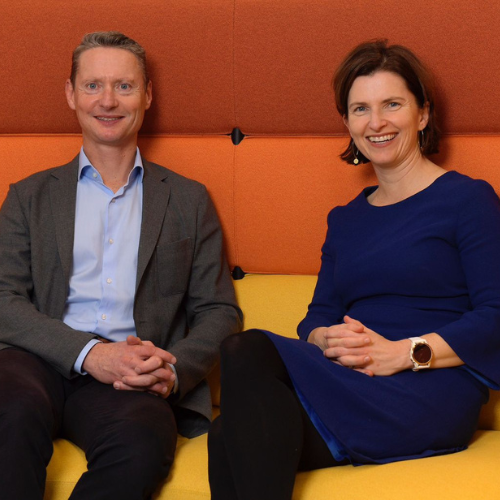 Business professionals sitting on modern couch – corporate leadership, venture capital Australia, startup investment Sydney.